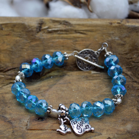 Pulsera de cristal azul agua con la esperanza